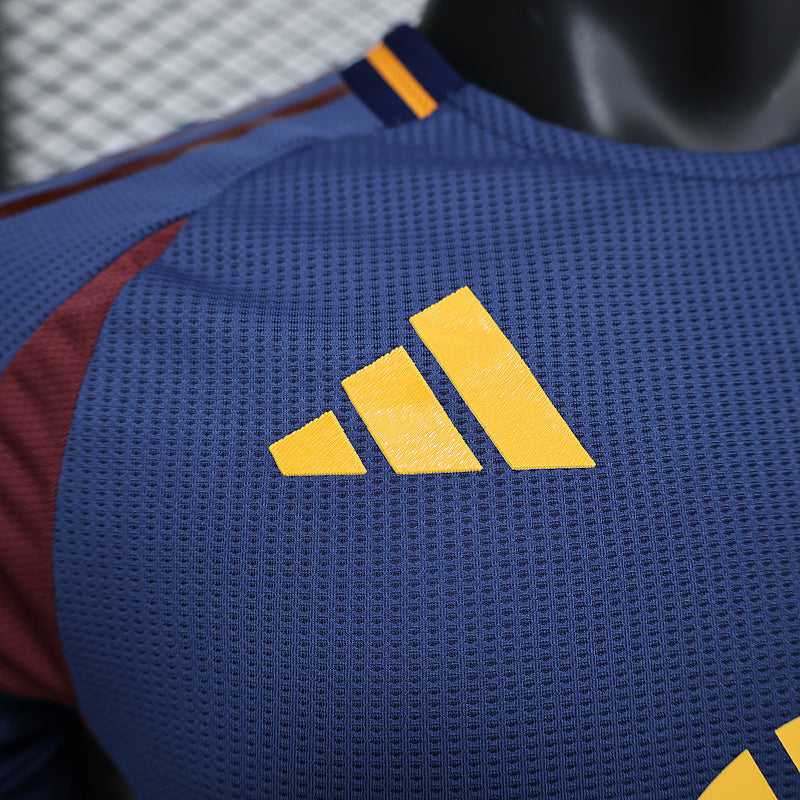 Blue jersey chest close-up with yellow adidas stripes