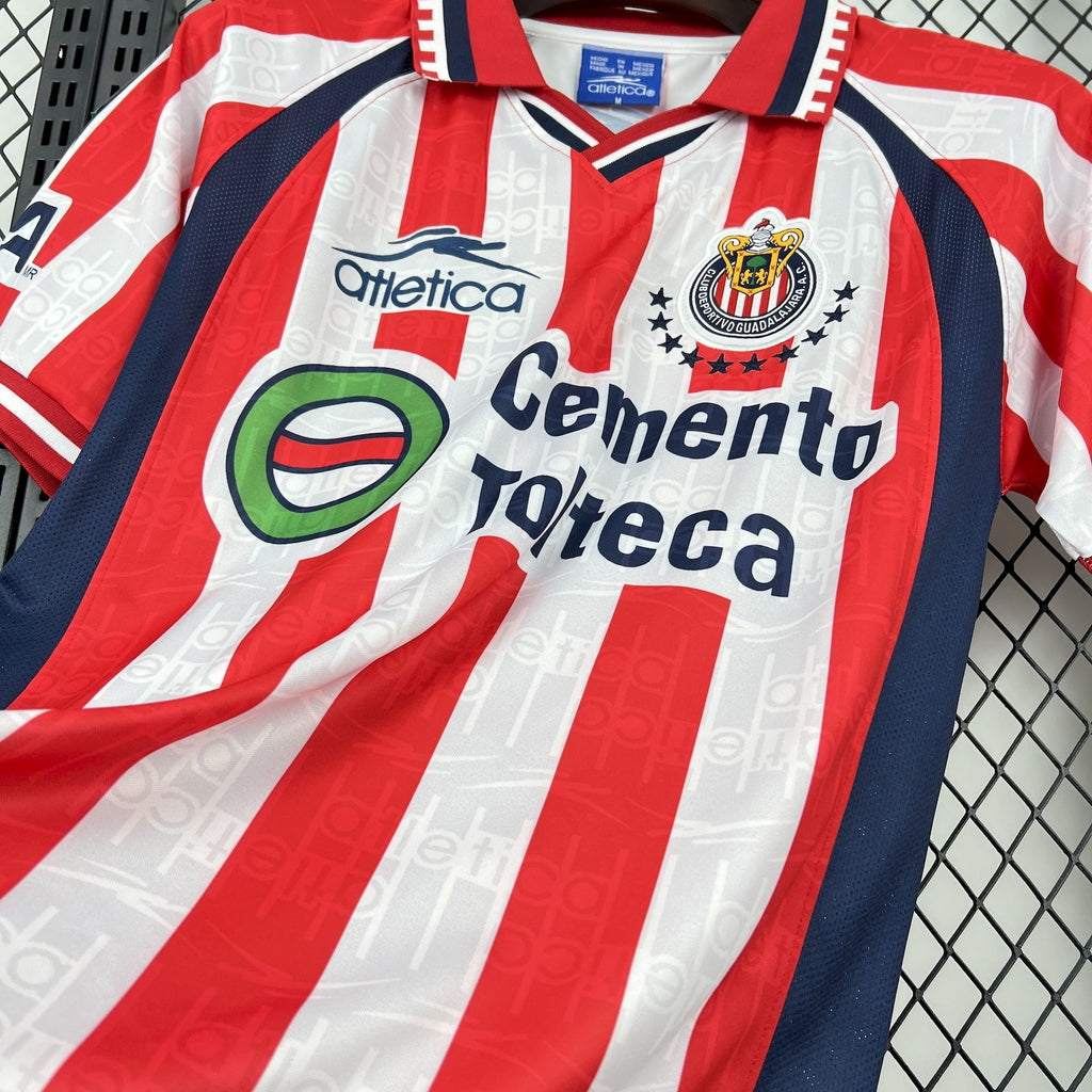 Retro home soccer jersey front close-up with Cemento Toteca sponsor and red/white stripes