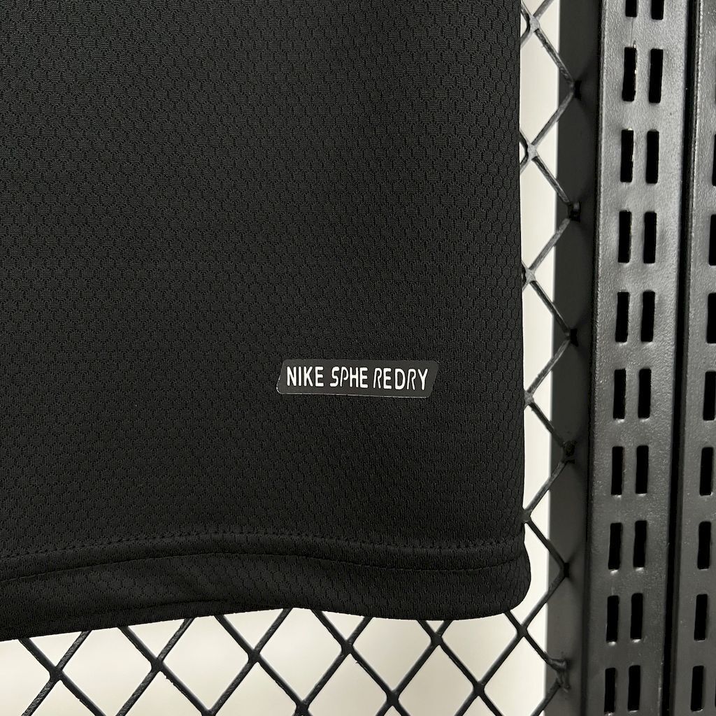 Black jersey sleeve with white 'NIKE S F E REDRY' label