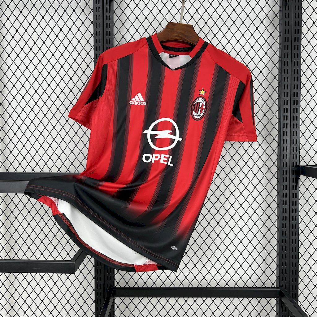 Red and black striped soccer jersey, crew neck, AC Milan crest and adidas logo