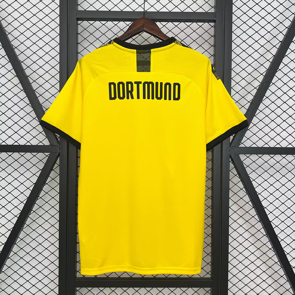 Yellow football jersey back with DORTMUND text and BVB crest