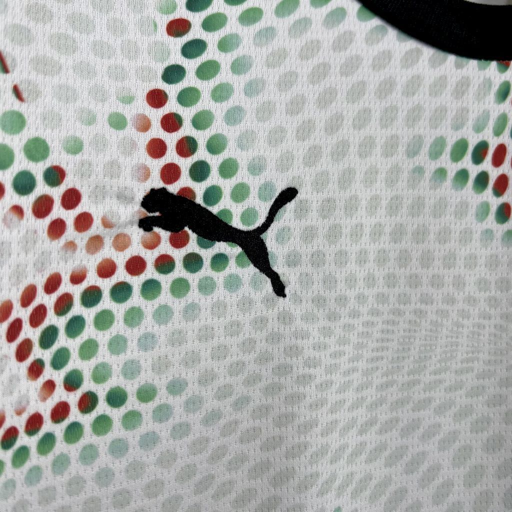 Puma logo on white kids jersey fabric with multicolor dot pattern
