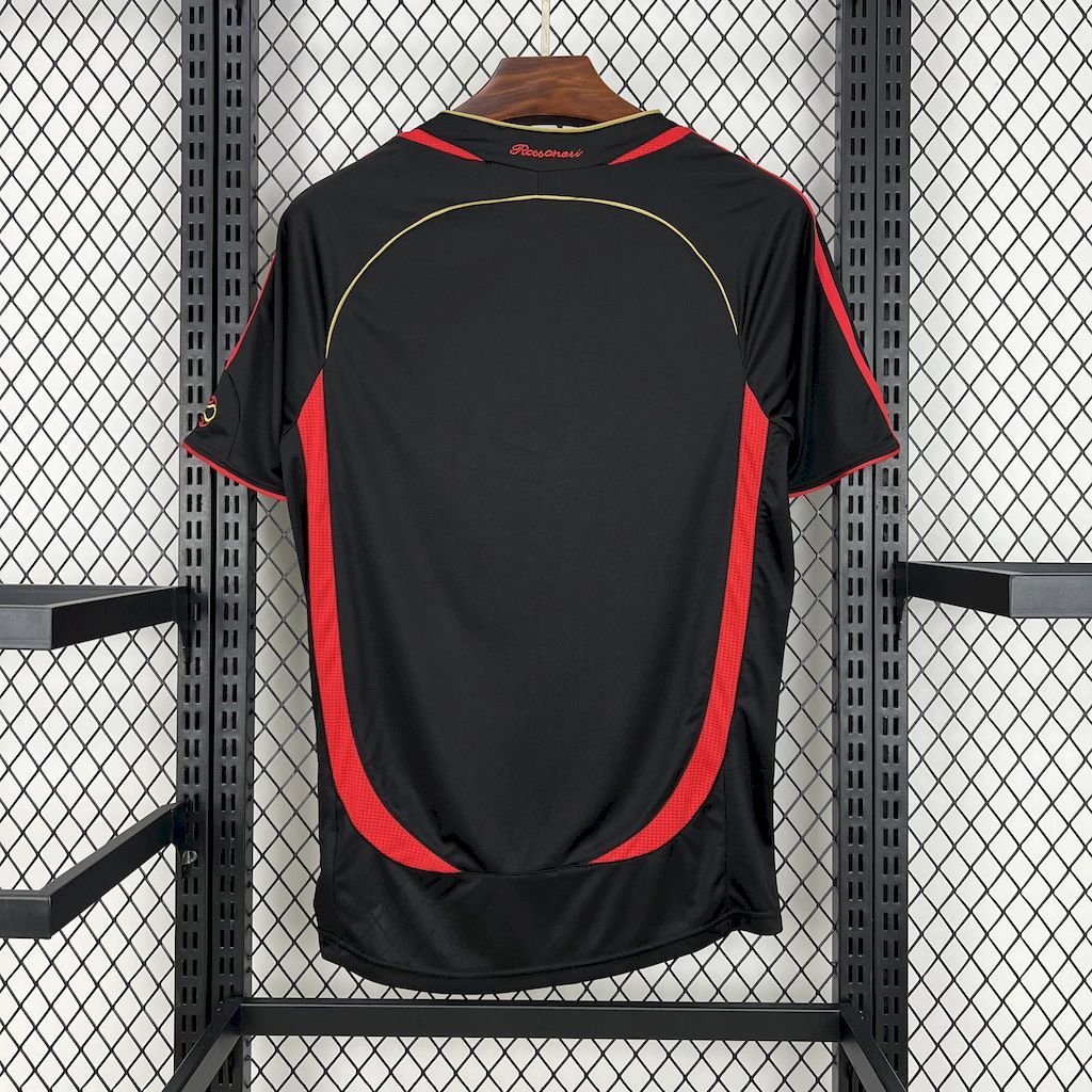 Black AC Milan retro football jersey back view with red side stripes and curved yellow trim