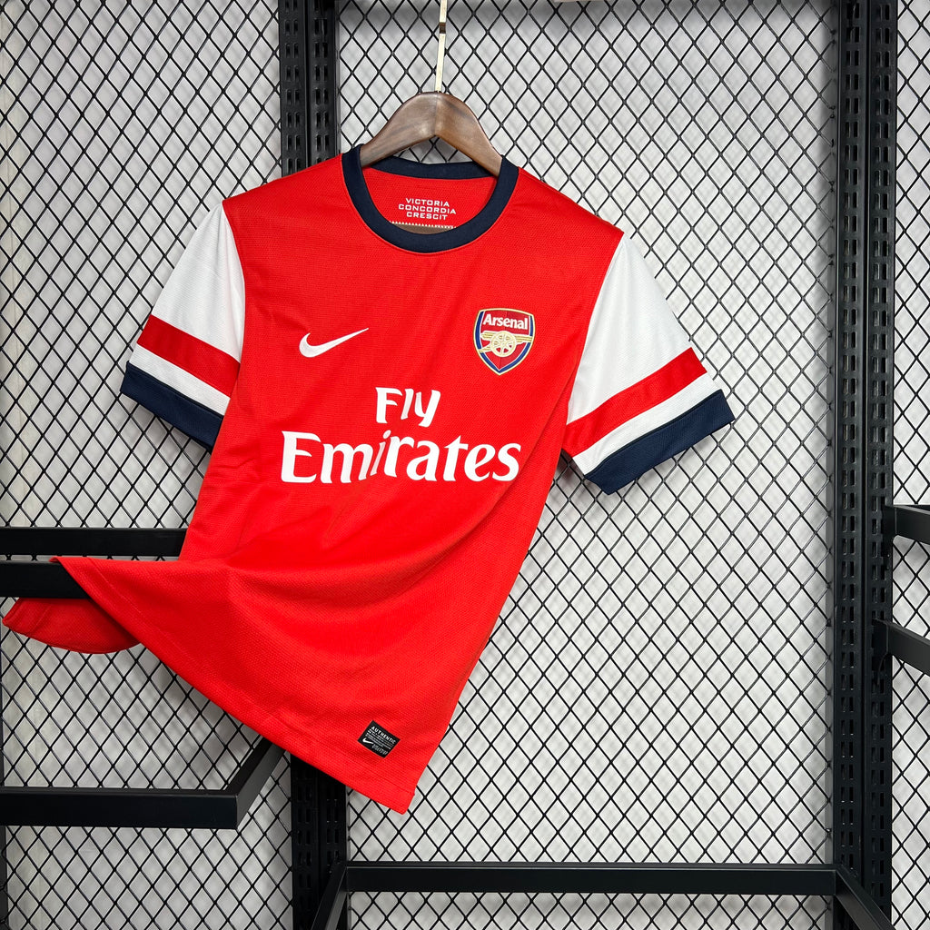 Red Arsenal home football jersey with Fly Emirates sponsor and Nike swoosh