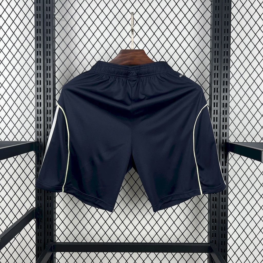 Navy fan shorts with back panel detailing, light green piping, and side stripes