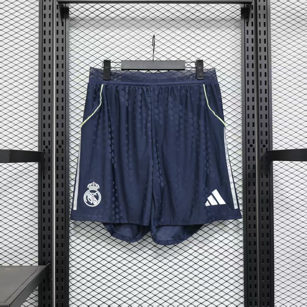 Navy player shorts with elastic waistband, lime piping, Real Madrid crest, and adidas logo