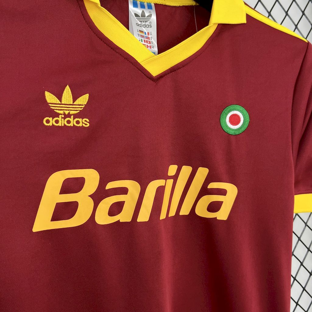 Maroon jersey front with adidas logo, Barilla text, and Roma crest