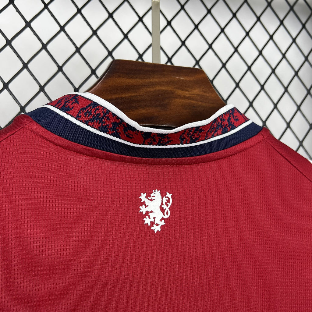 Close-up of red jersey collar with blue trim and Czech crest detail