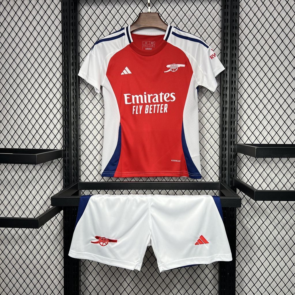 Kids football kit: red-and-white jersey with blue trim and white shorts with blue trim