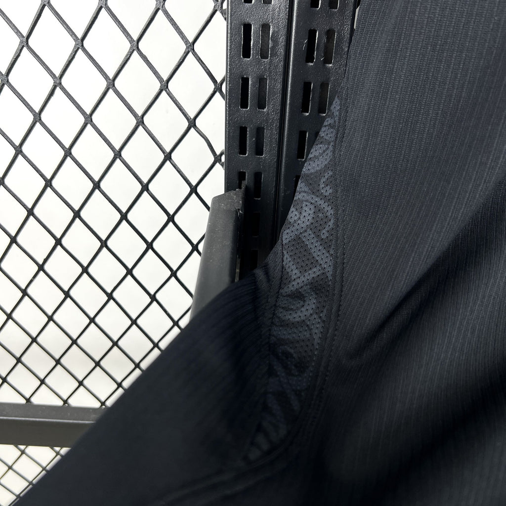 Norway away fan soccer jersey sleeve close-up in dark navy with curved seam detail