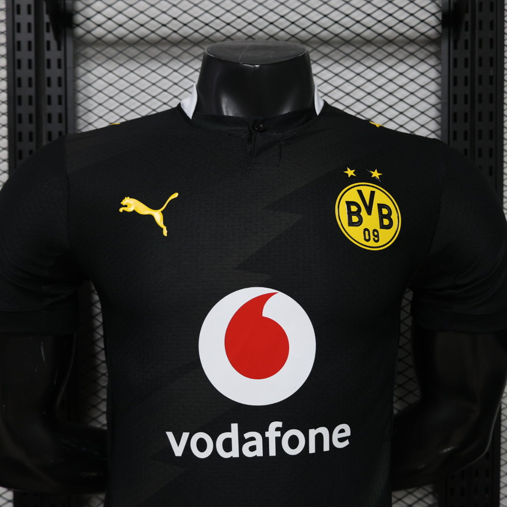 Black BVB football jersey with Puma logo, club crest, stars, and Vodafone sponsor