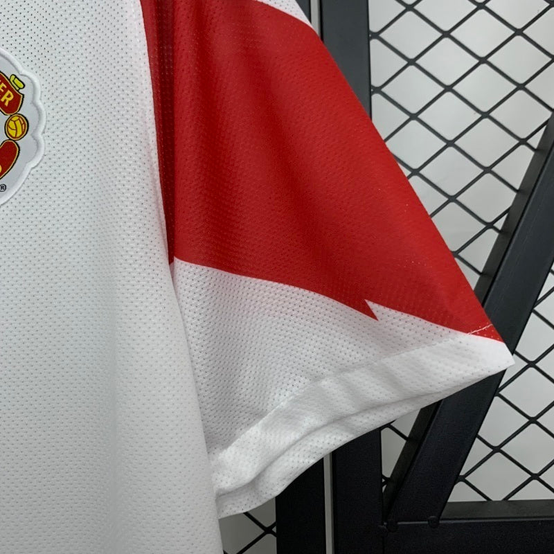 Red and white sleeve panel on white away football jersey