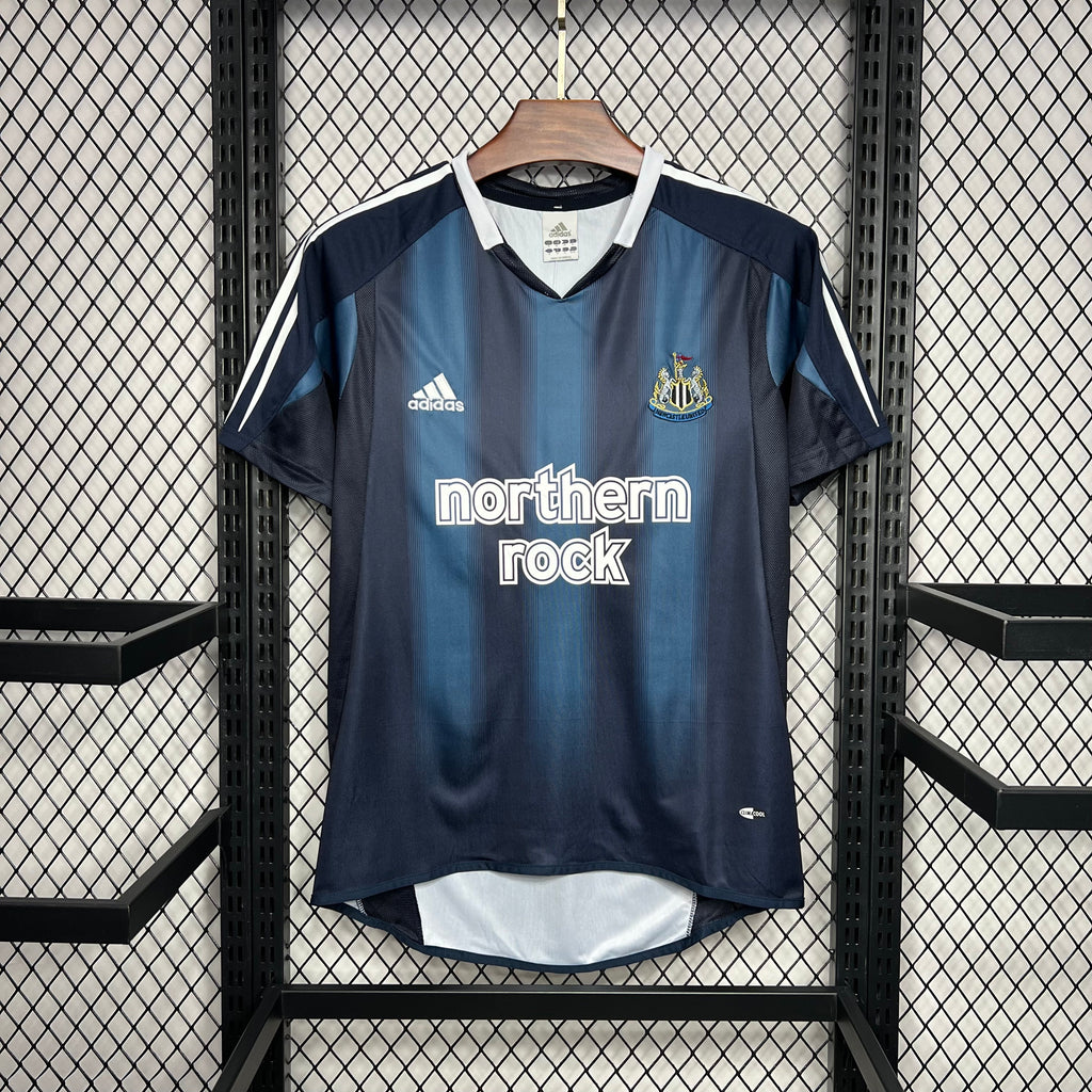 Navy and light-blue Newcastle away soccer jersey, adidas and northern rock front print