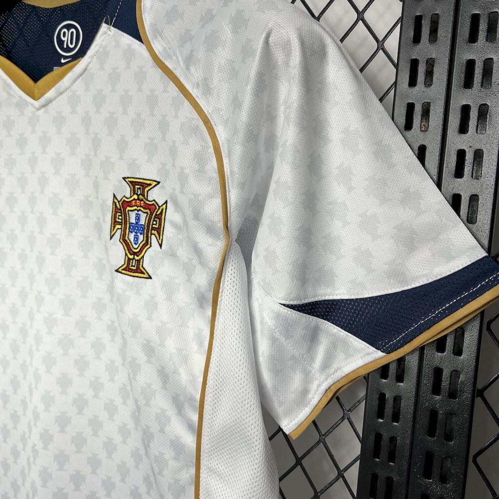 White jersey sleeve with navy cuff and gold piping detail