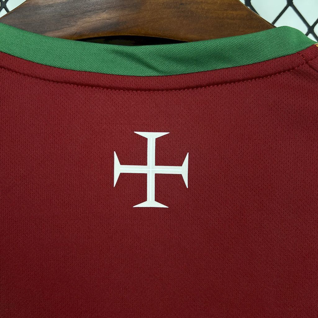 Maroon soccer jersey back collar with white cross crest emblem