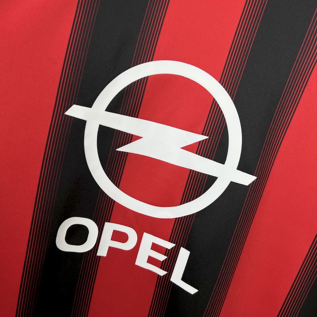 Red and black striped jersey with white Opel sponsor logo