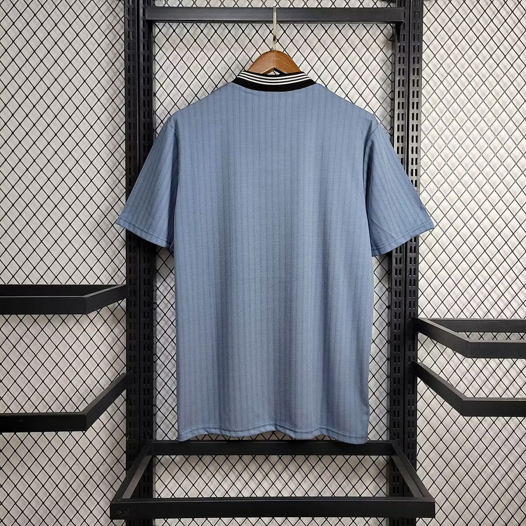 Light blue football jersey back view with short sleeves and plain crew collar