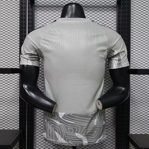 Grey goalkeeper football shirt, back view on mannequin with curved seams and elastic hem