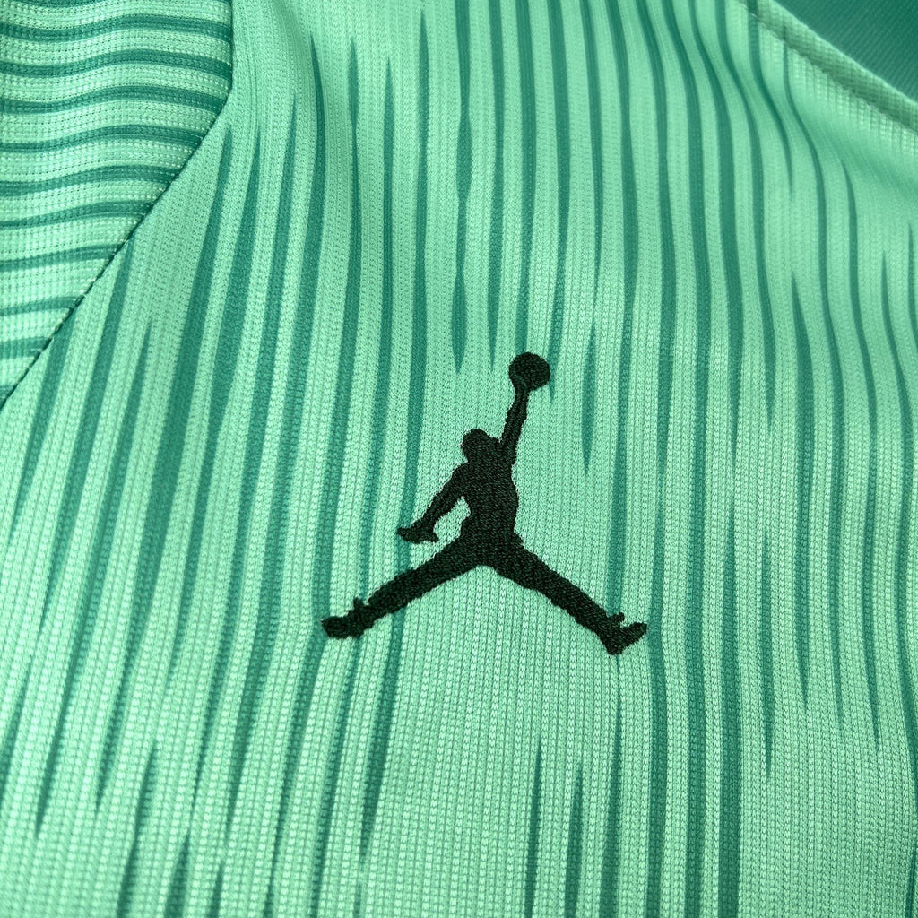 Black Jordan Jumpman logo on turquoise goalkeeper jersey fabric