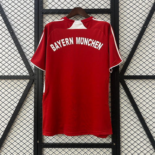 Red Bayern Munich home soccer jersey back view with “BAYERN MUNCHEN” lettering