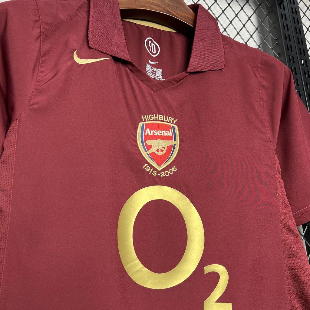 Maroon football jersey front with crest, Nike swoosh, and gold O2 emblem