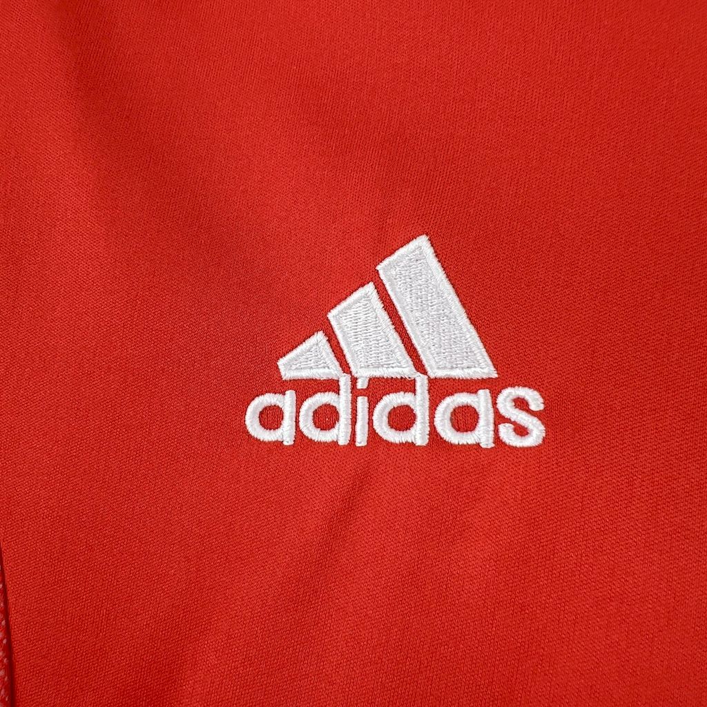 Red soccer jersey with white adidas logo print