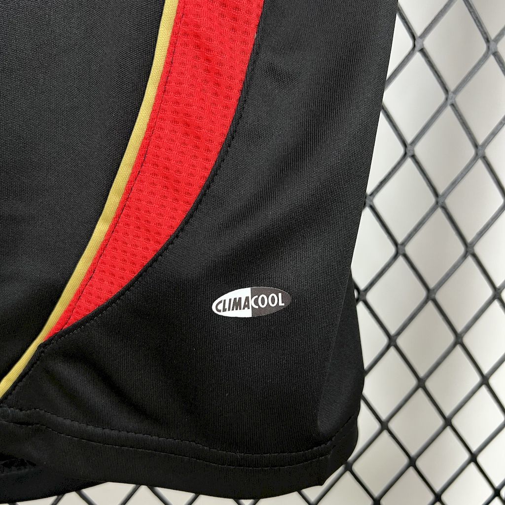 Black sports jersey sleeve with CLIMACOOL label, red panel and yellow piping