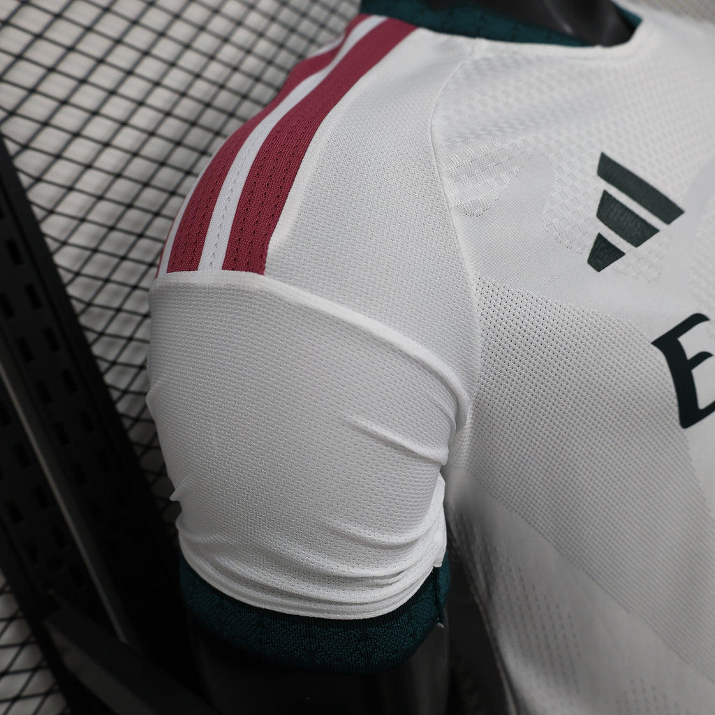 White football jersey sleeve with adidas logo and maroon-and-teal accent stripes