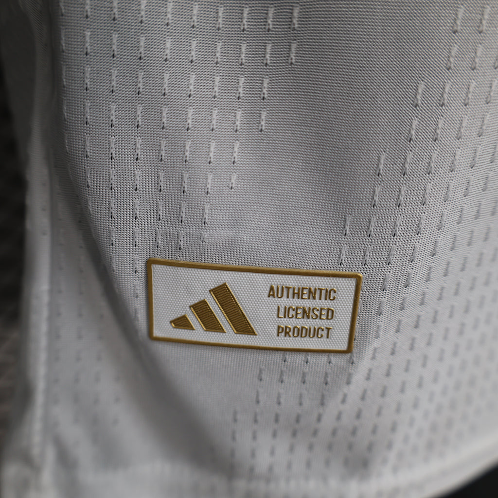 White football jersey label close-up reading “Authentic Licensed Product” with adidas mark