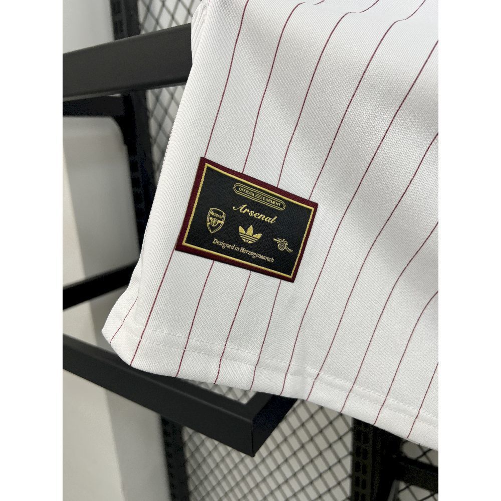 Arsenal 2025/26 terrace icons football shirt label, maroon pinstripes on white fabric