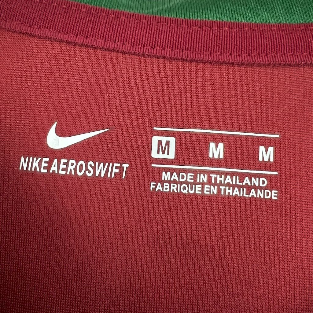 Maroon jersey detail: NIKE AEROSWIFT text and size M Made in Thailand label