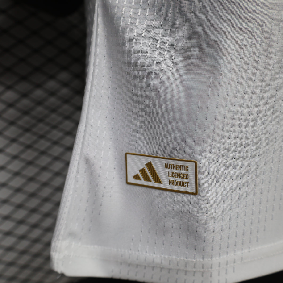 White jersey with Authentic Licensed Product label near the hem