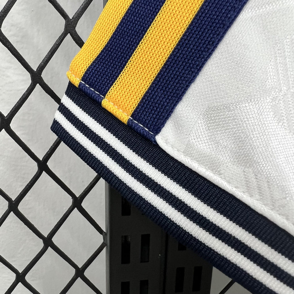 White Real Madrid OG casual shirt sleeve cuff with navy-and-yellow striped trim