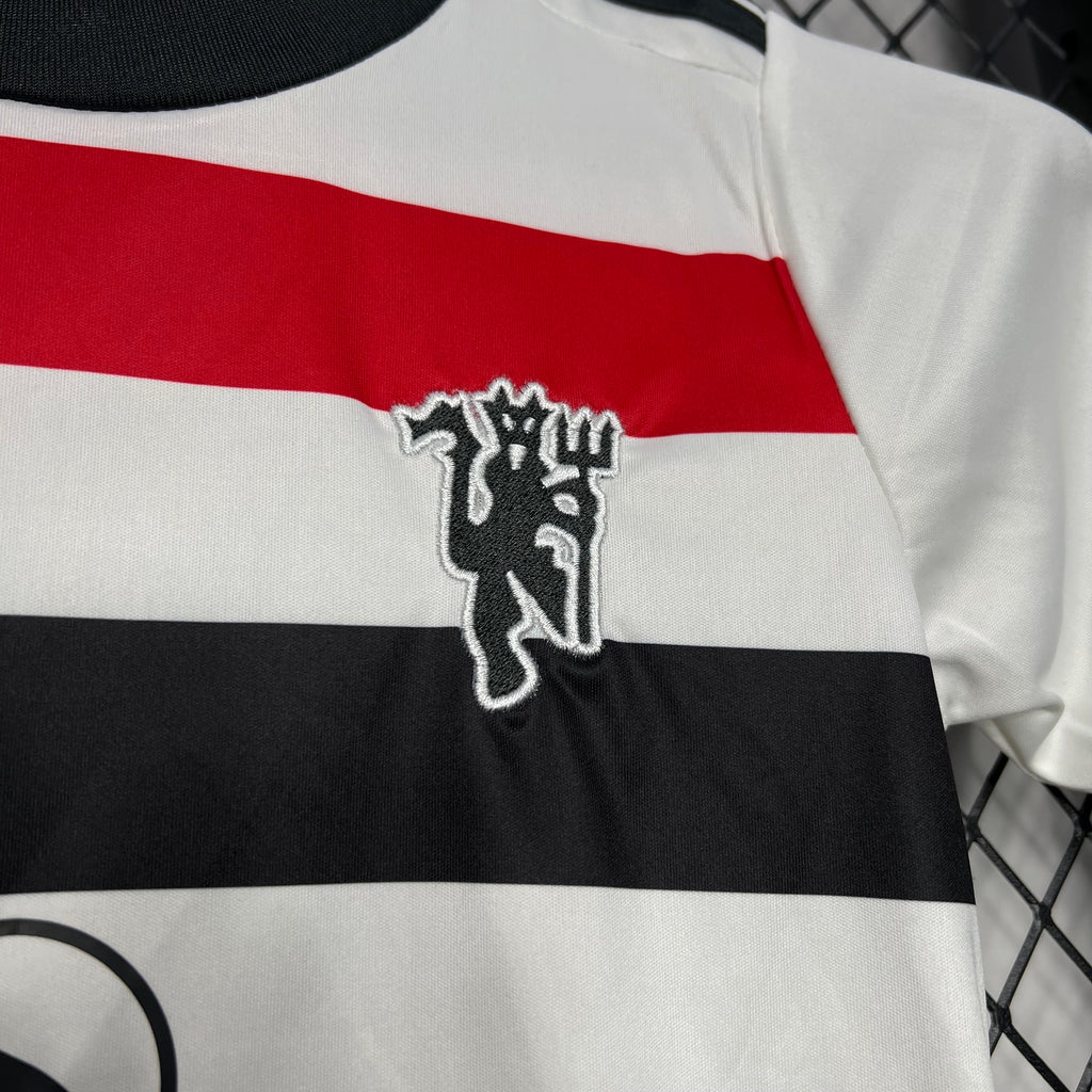 Kids jersey chest emblem over black-red-white horizontal stripes
