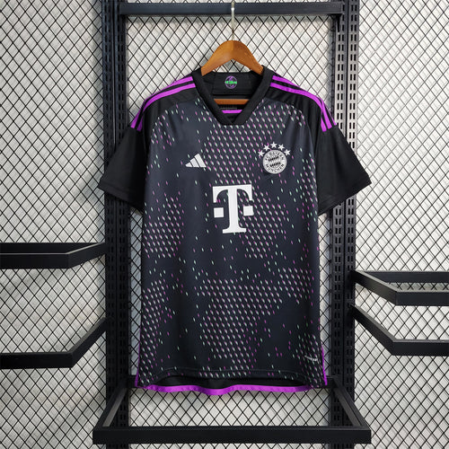 Black FC Bayern away soccer jersey with purple trim and front crest