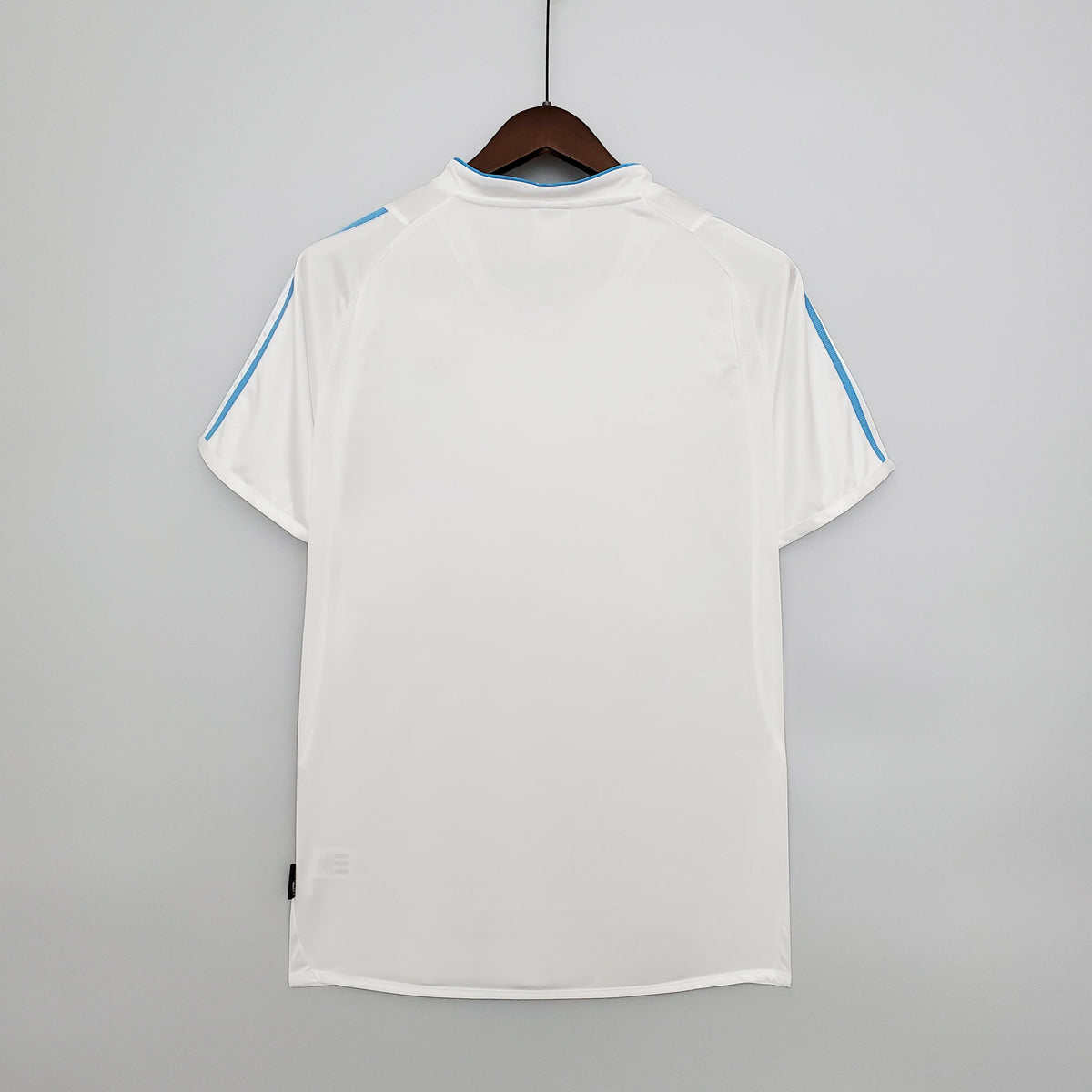 White football jersey back view with blue shoulder stripes