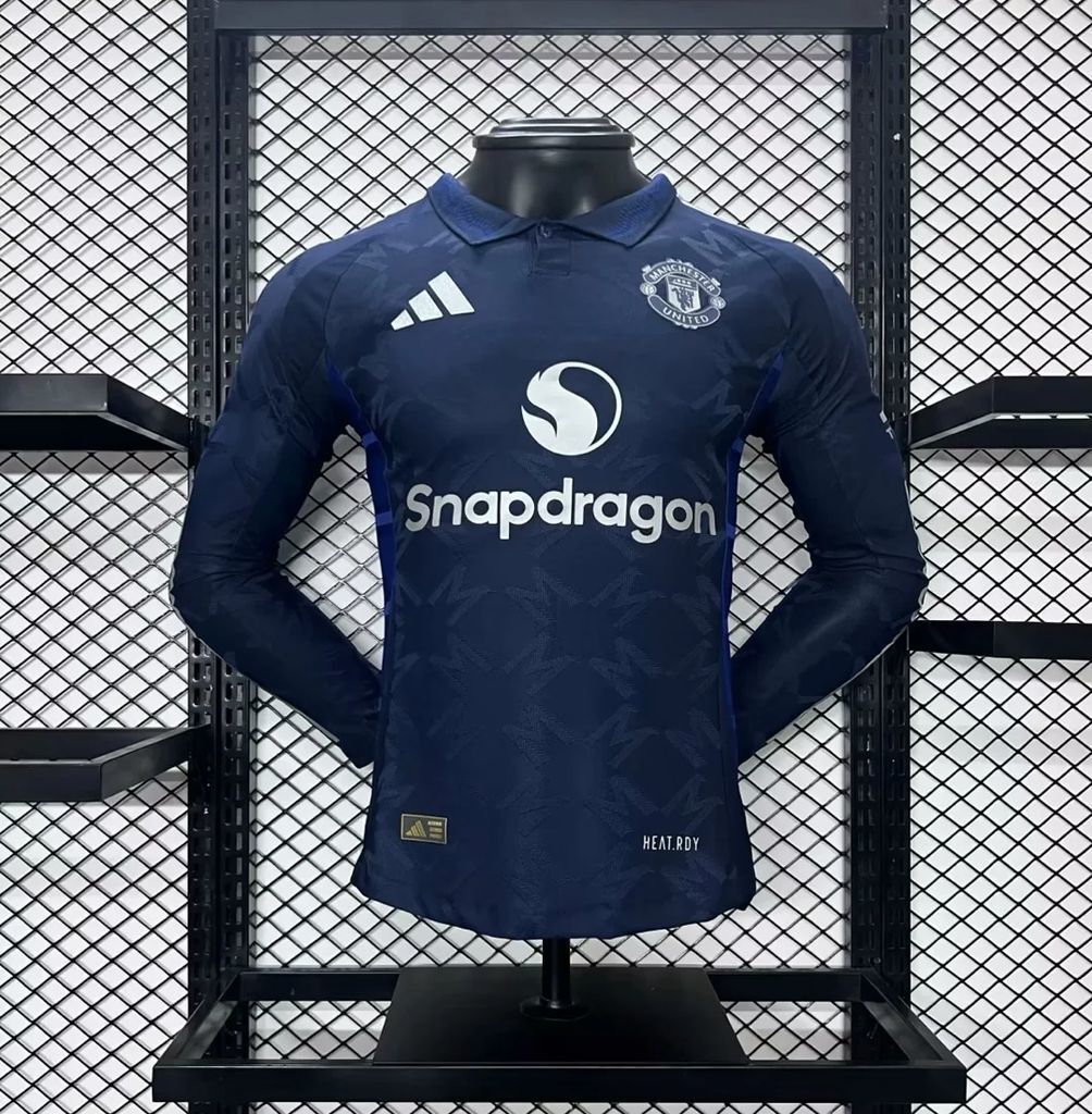 Dark blue Manchester United away long-sleeve jersey, sponsor and club crest on front