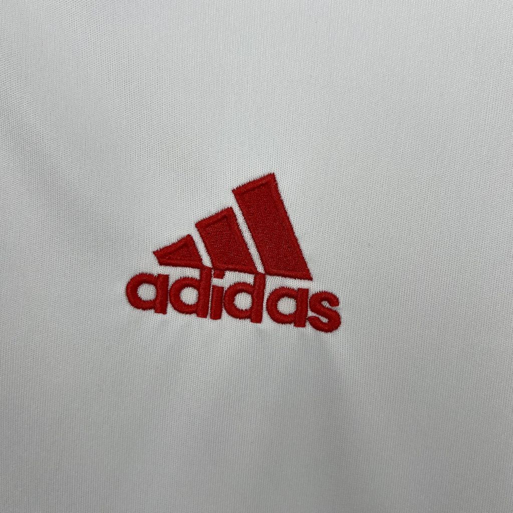 White jersey chest with red adidas logo