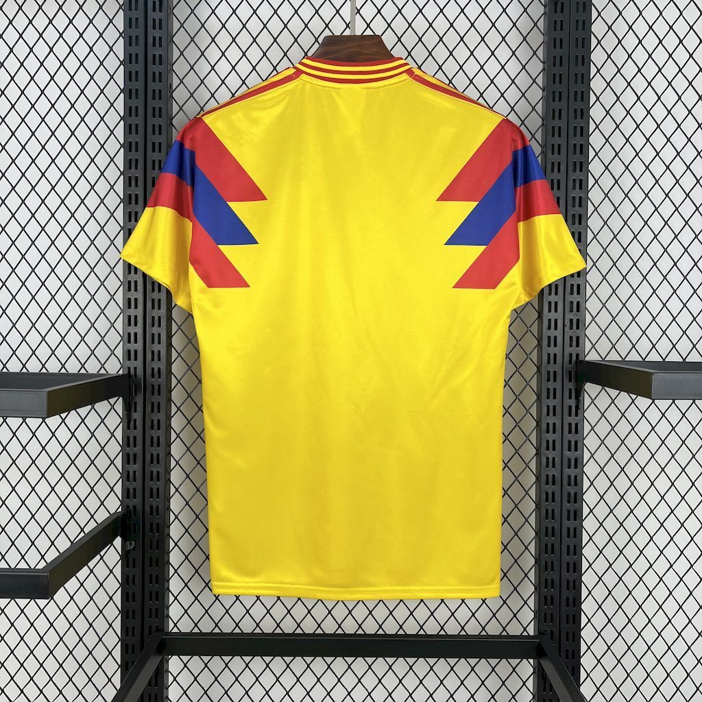 Yellow Colombia retro home soccer jersey, back view with maroon and blue panel graphics