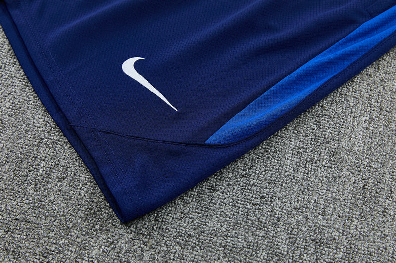 Navy training shorts with white Nike swoosh logo on the leg