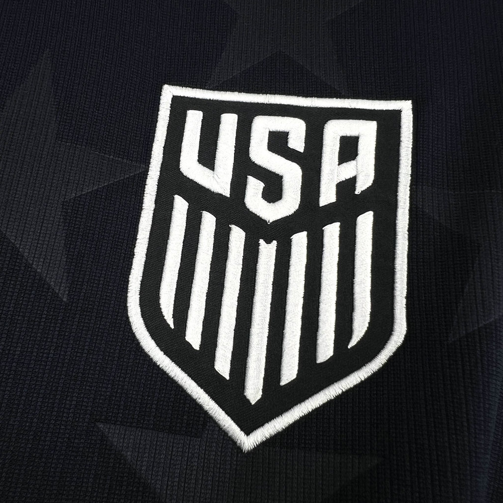 USA crest patch on navy jersey fabric