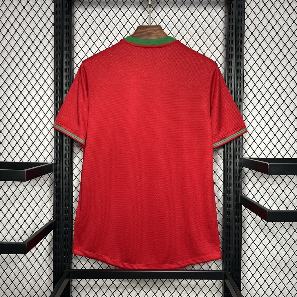 Red soccer jersey with green collar trim and short sleeves, back view.
