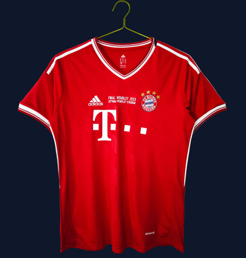 Red Bayern Munich home football jersey with white V-neck trim and crest on chest