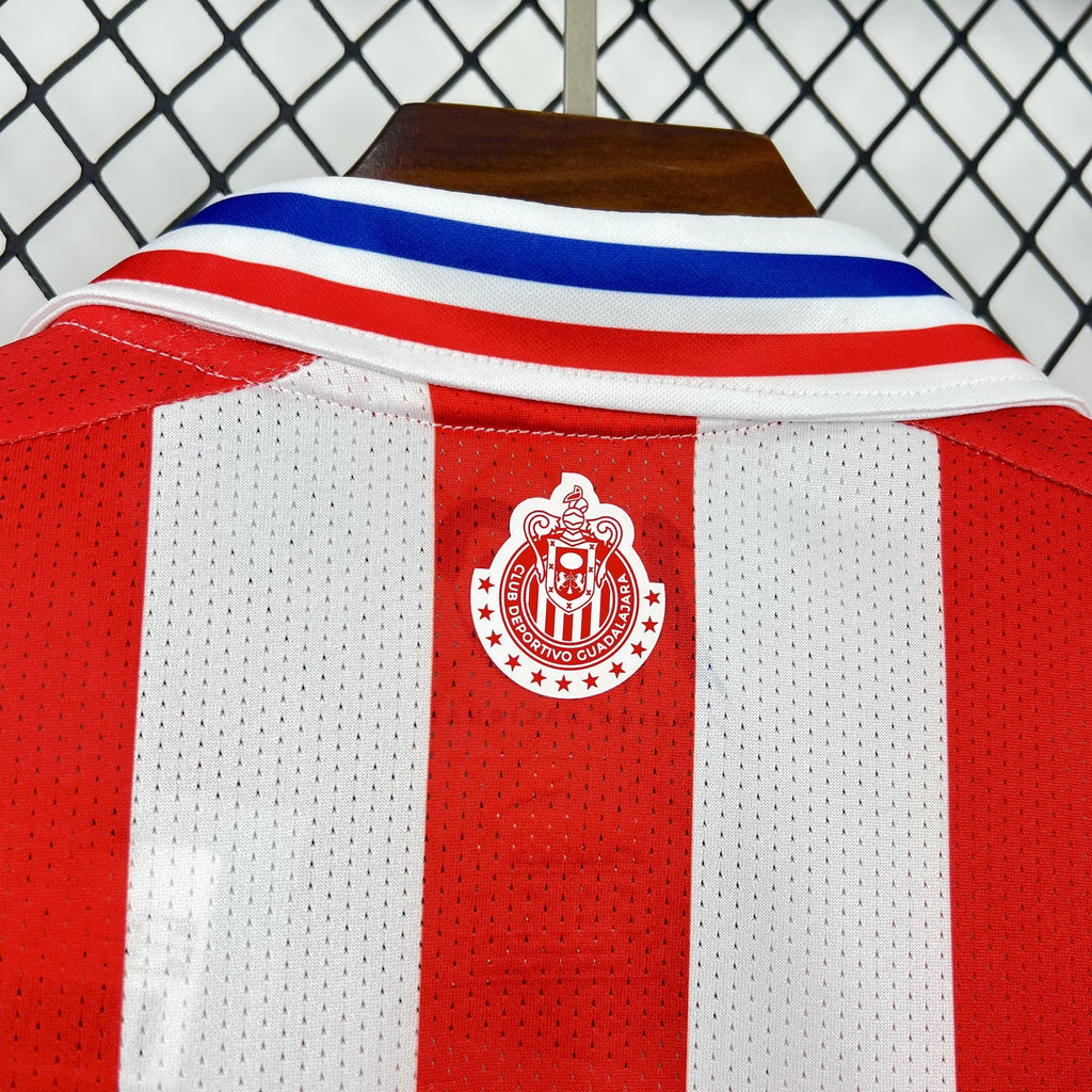 Retro soccer jersey shoulder panel with red crest and blue collar stripe detail.