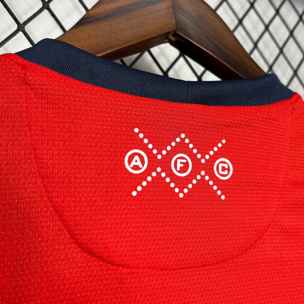 Red jersey back collar with white armband icon detail