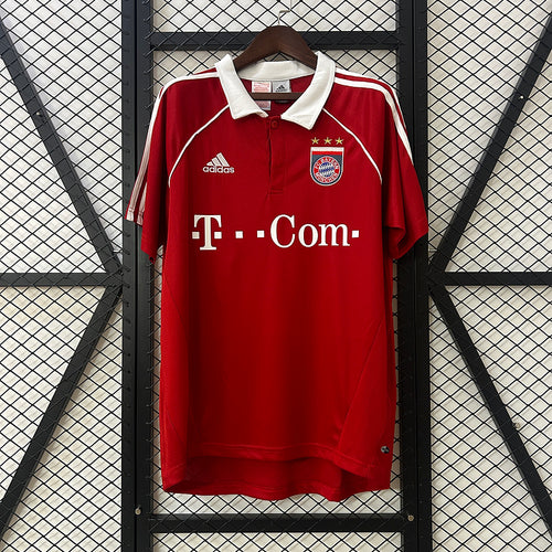 Red Bayern home football jersey with white collar and T-Com sponsor front