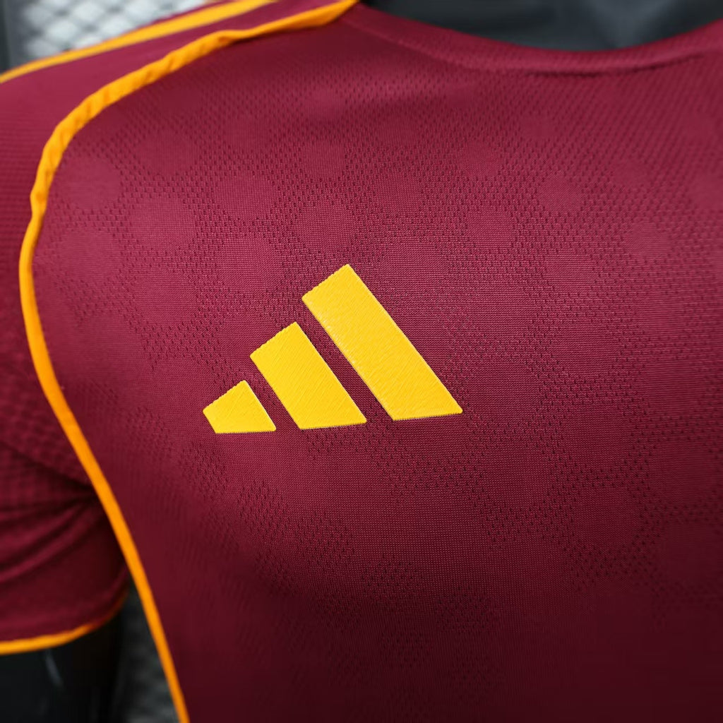 Maroon jersey with large yellow adidas three-stripe logo on the upper back.