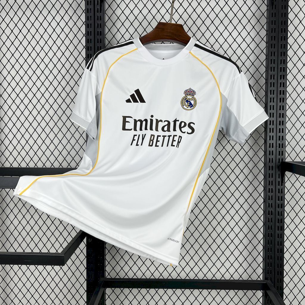 Real Madrid home fan jersey, white with yellow trim and Emirates sponsor front