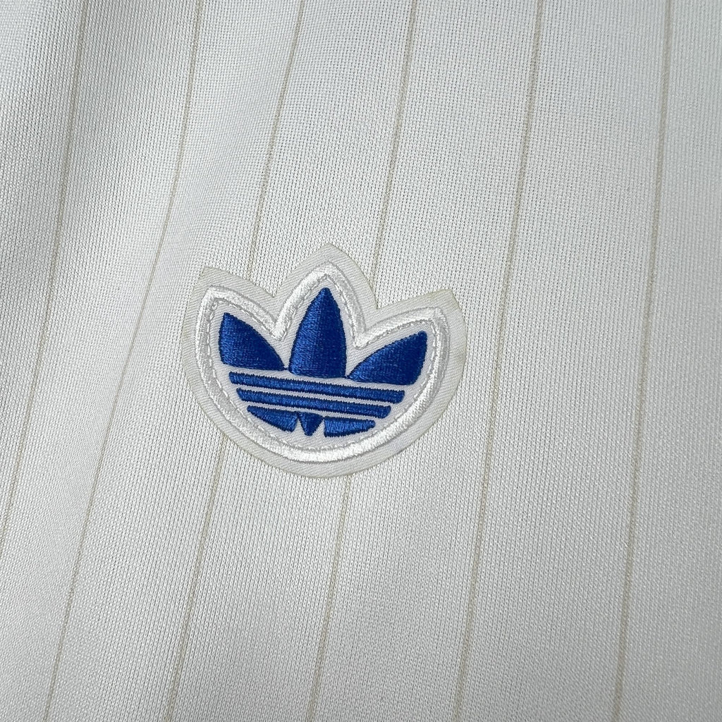 Adidas trefoil logo on white pinstriped jersey