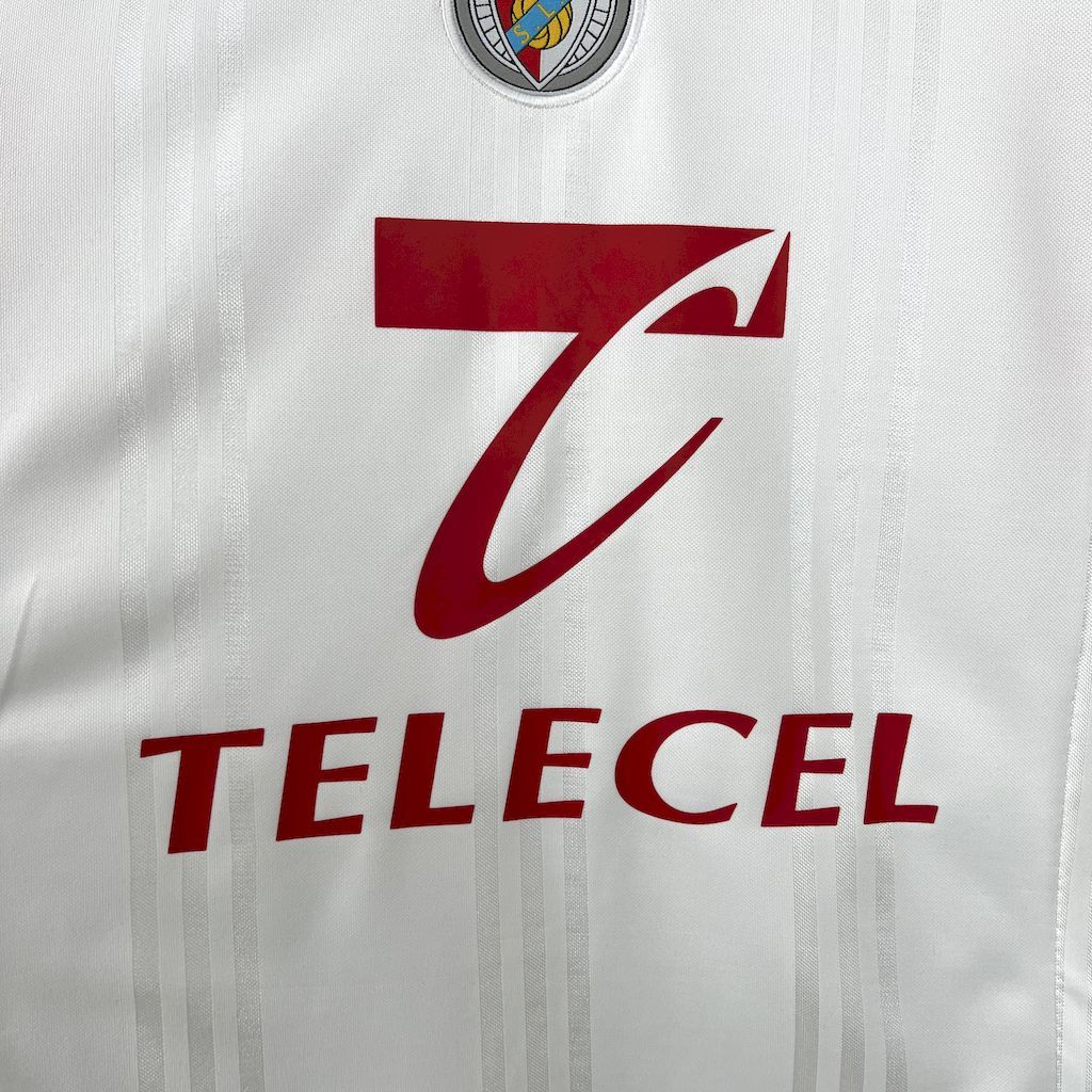 White soccer jersey front with Telecel text and large red swoosh logo